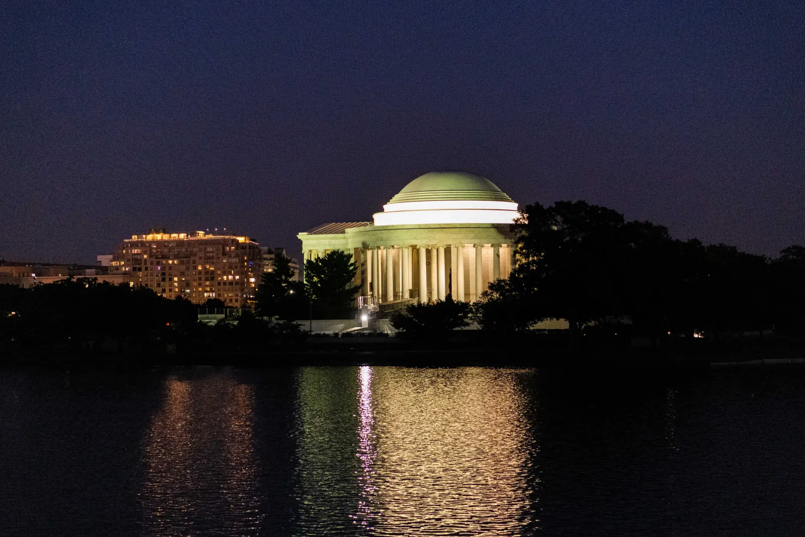 The Jefferson Memorial lit up across the Tidal Basin at night