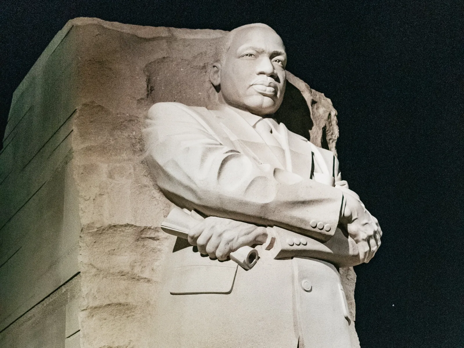 The Martin Luther King Jr. Memorial statue lit at night