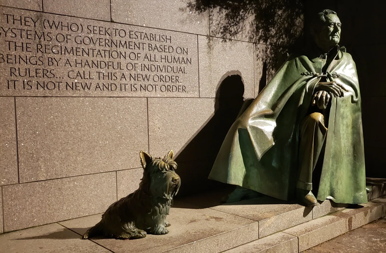 The Franklin Delano Roosevelt Memorial statue and his dog Fala at night