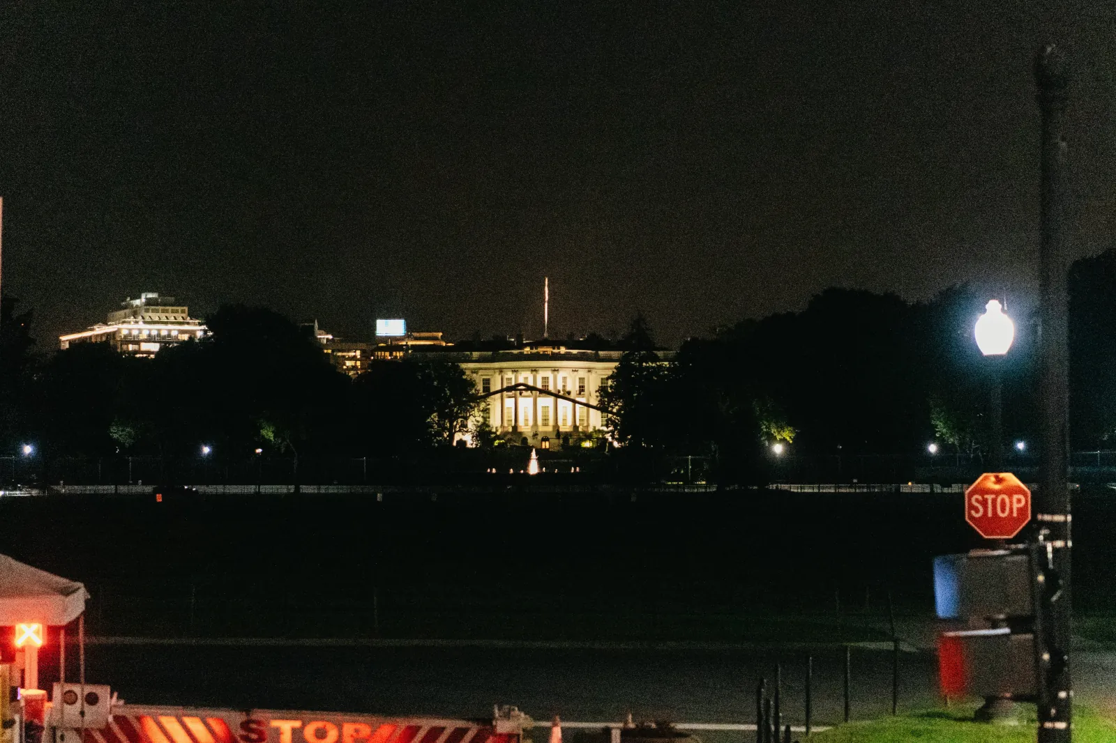 The White House lit up at night across the Ellipse
