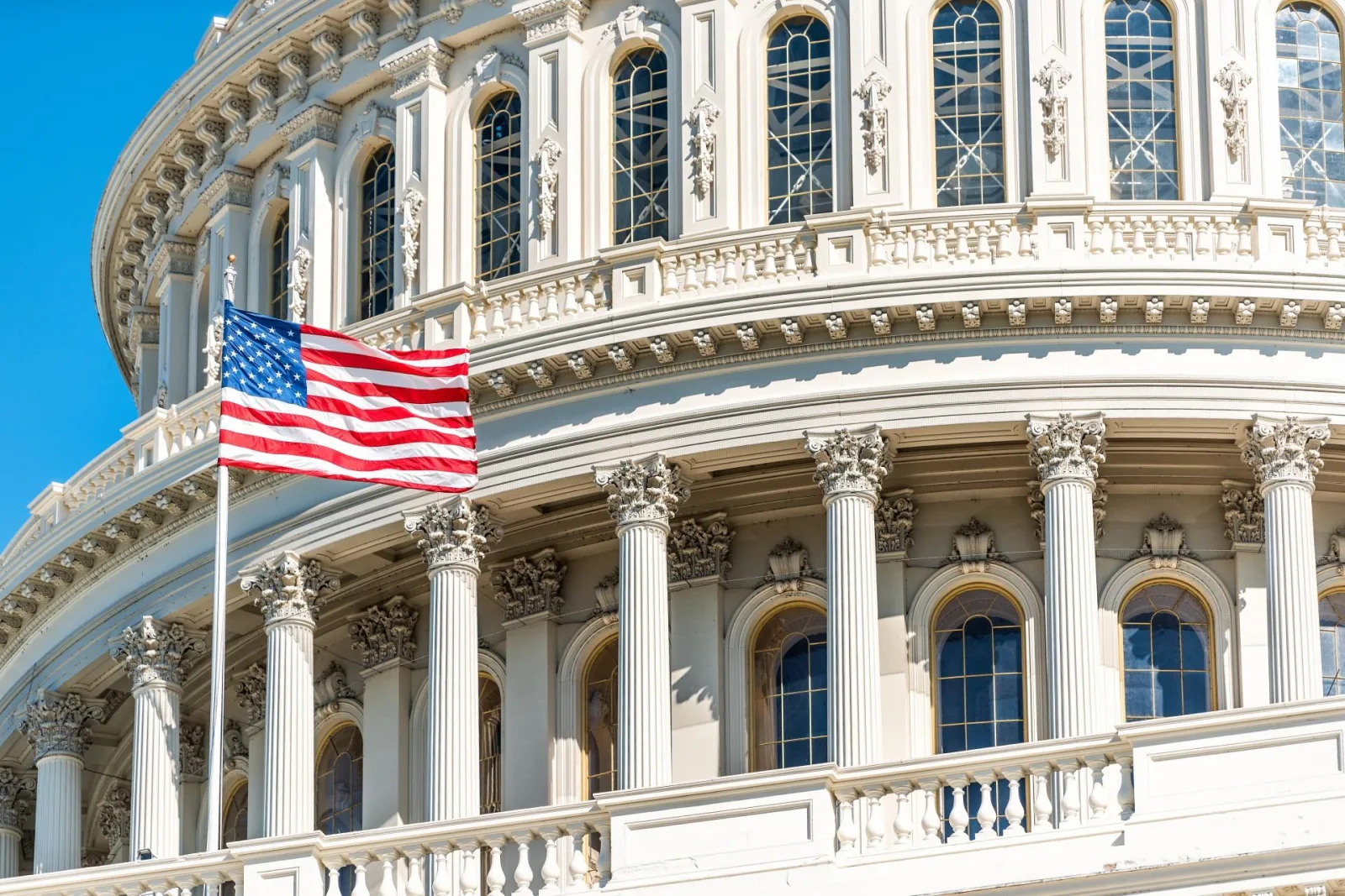 The Capitol dome and colonnade with the American flag