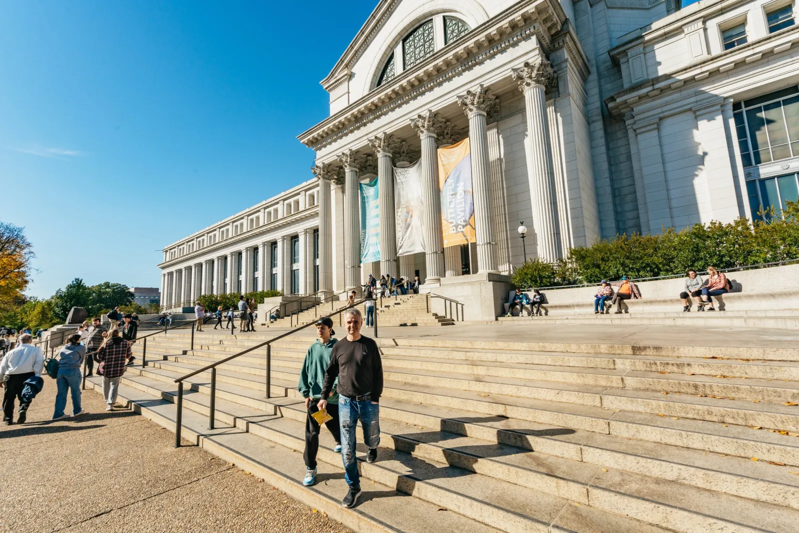 Visitors on the steps of a Smithsonian museum on the National Mall